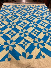 Handstitched blue/yellow floral quilt