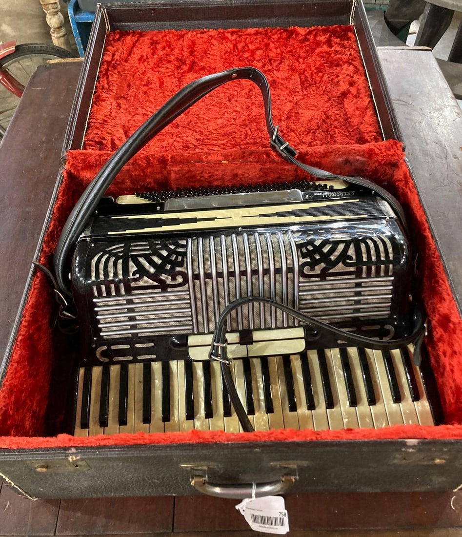 Petromill Italian Accordian: Mother of pearl keys, with leather detail. This instrument is made with quality. Velvet lined case included. Very good condition. Marked Cleveland Ohio