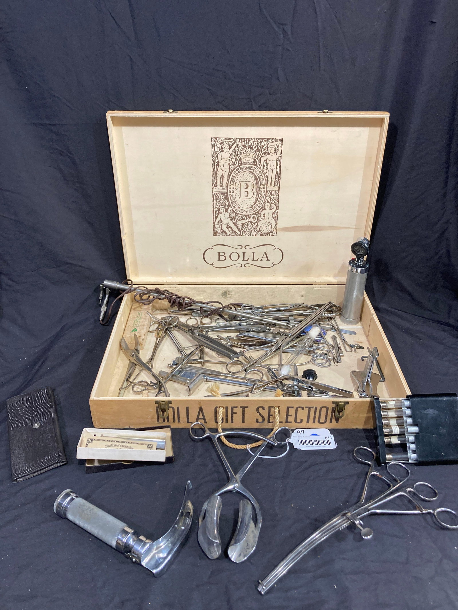 Numerous medical utensils and tools: Large lot of medical tools in a Bolla wine box.