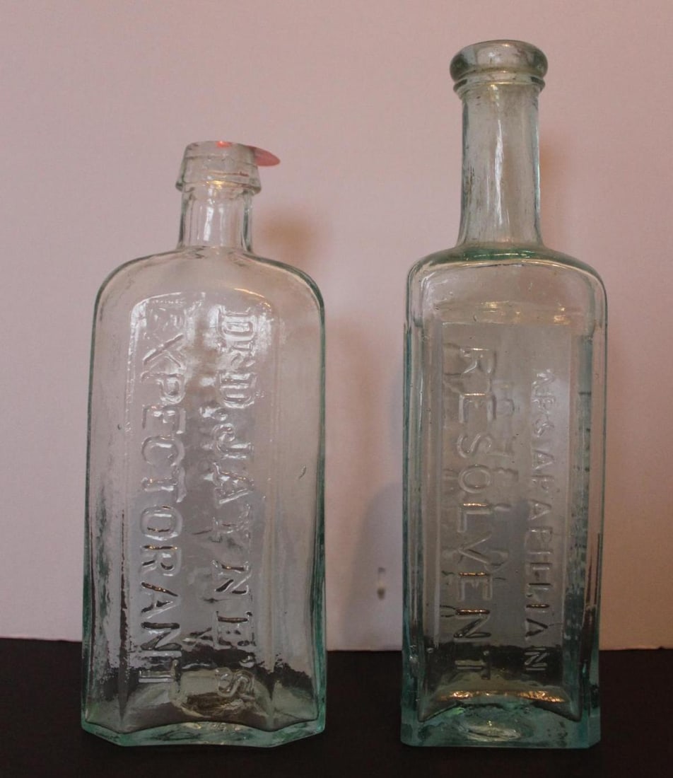 Dr D. Jaynes Expectorant and Radways Resolvent Glass Bottles: Both bottles are embossed, in great condition with no major chips or cracks. 6.5 and 7.5 inches tall