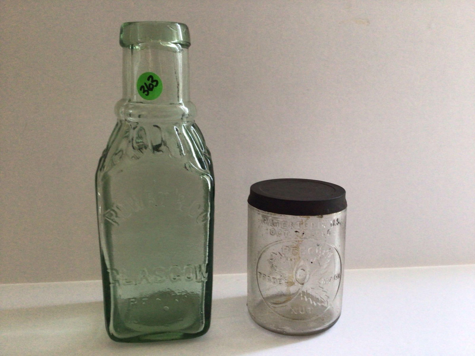 Beech Nut and Rowat & Co Embossed Jars: Beech Nut glass jar with lid pat 1900, 4.5 inches tall. Rowat bottle is 9.5 inches tall, Glasgon.