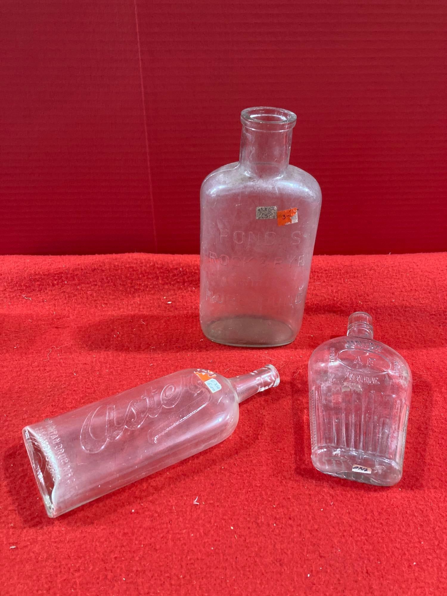 UNION, ASTER, AND PONDS EMBOSSED BOTTLES: LOT OF 3