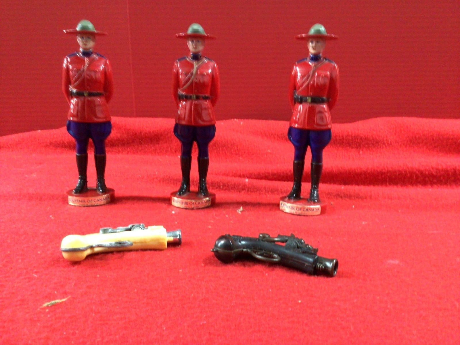 SOUVENIR OF CANADA RANGERS AND MINI CAP GUNS: PLASTIC RANGER FIGURES 7.5 INCHES TALL.