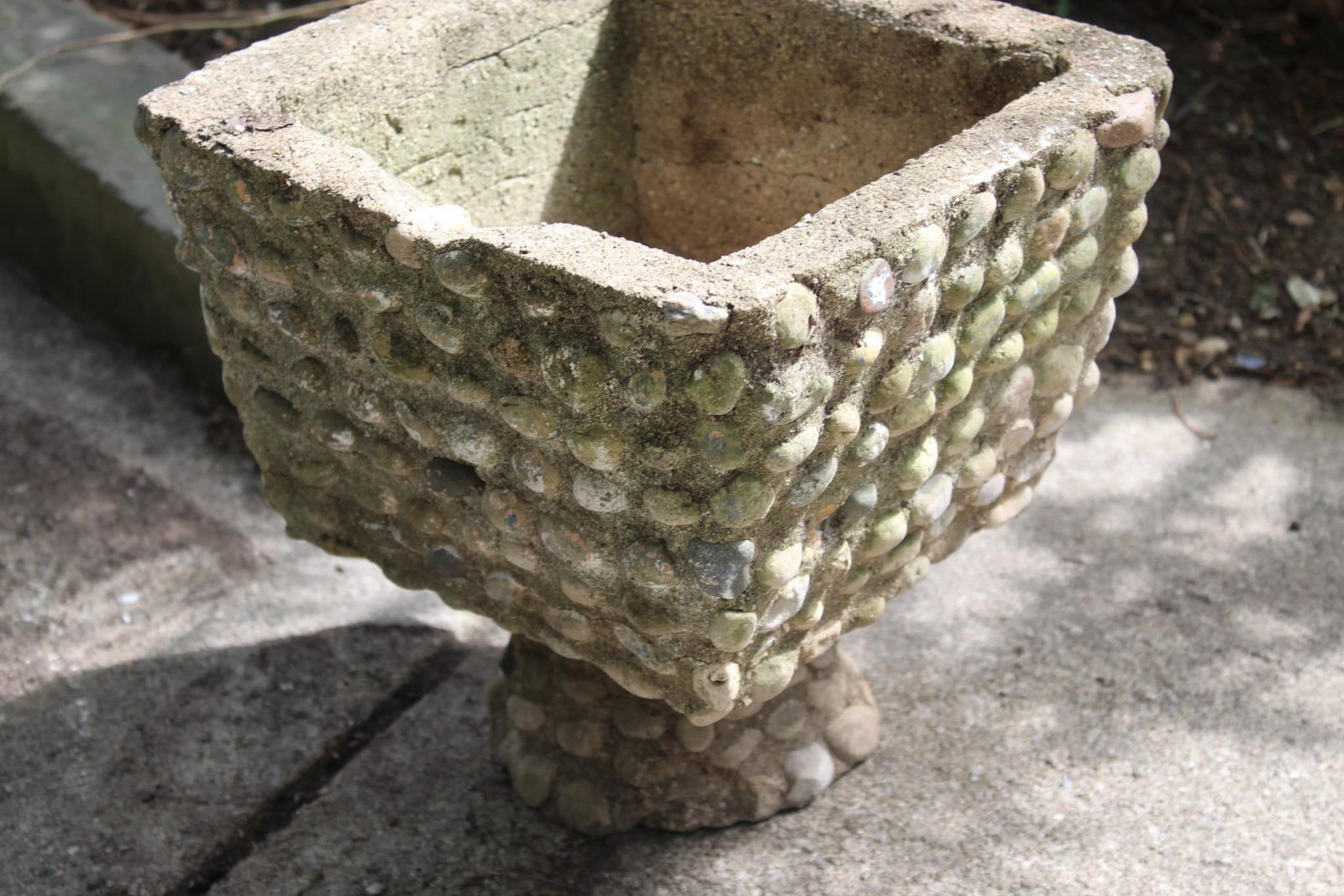 STONE PLANTER: HOLE ON CENTER FOR DRAINAGE. 12 X 12 X 12. A FEW MINOR CHIPS FROM TOP RIM