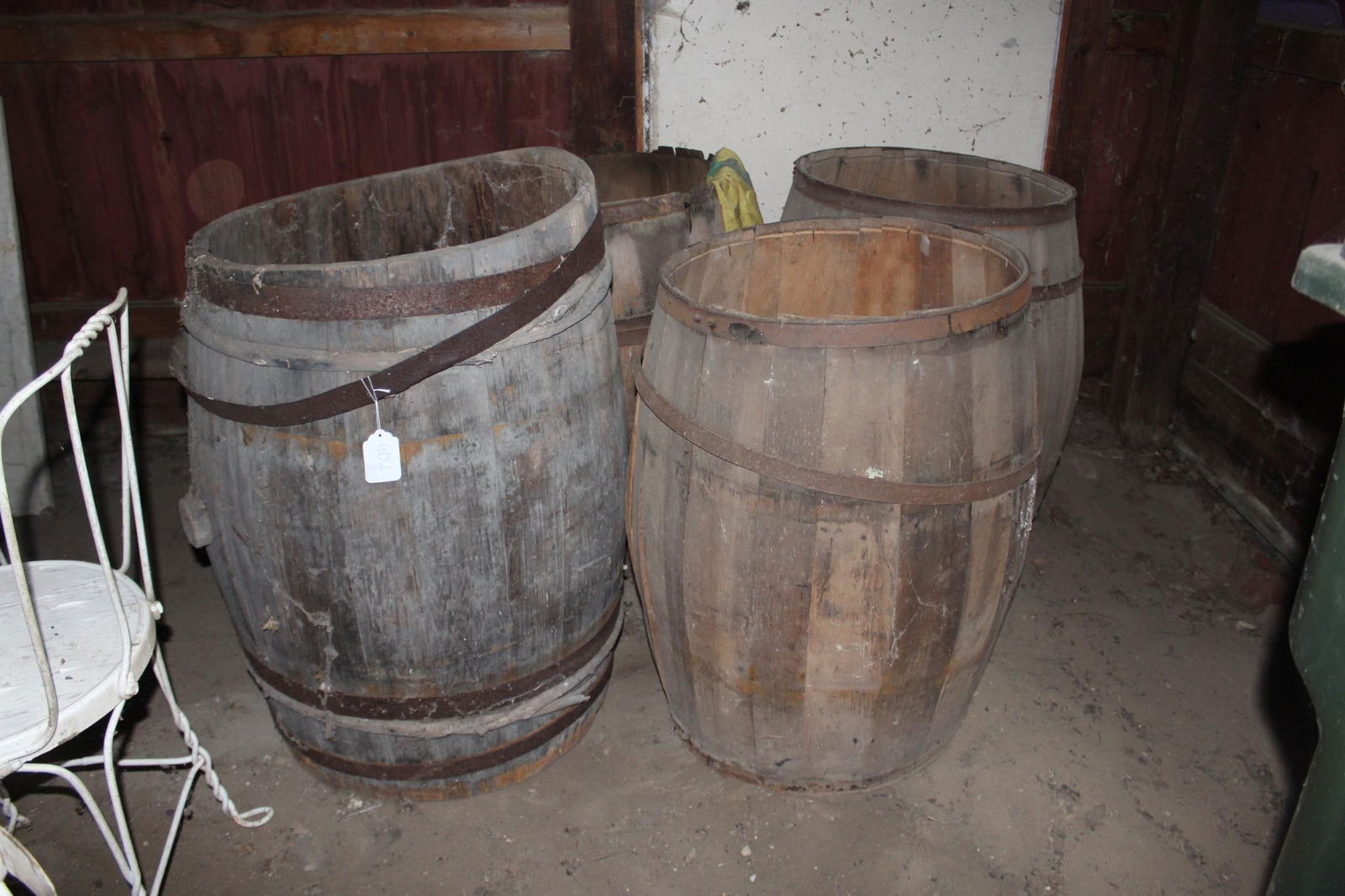 LOT OF 4 BARRELS: TWO ARE MISSING BOTTOMS. AVERAGE HEIGHT IS 33 INCHES TALL
