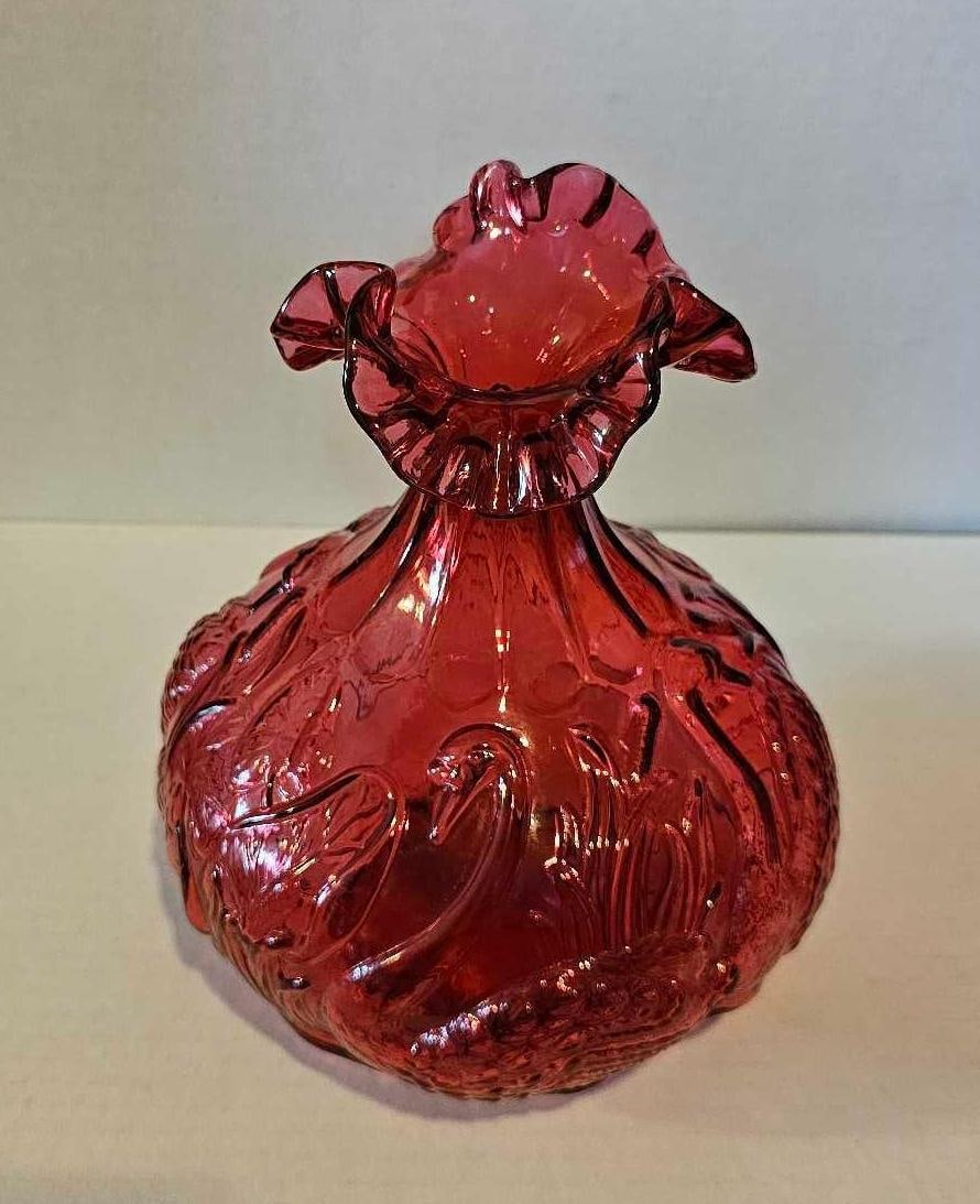 FENTON SWAN CRANBERRY GLASS VASE: MARKED FENTON ON BOTTOM. 8 INCHES TALL
