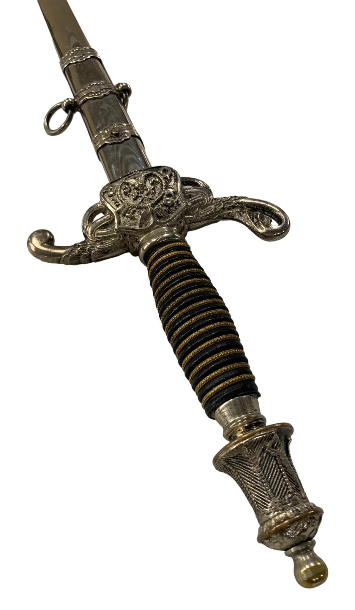 KNIGHTS OF THE MACCABEES CEREMONIAL SWORD: BY THE HENDERSON AMES CO. BLADE IS ETCHED FRED W CENTER ON ONE SIDE AND KNIGHTS OF THE MACCABEES ON OTHER SIZE, KALAMAZOO, MI, VERY ORNATE SHEATH AND HANDLE, 37 IN LONG