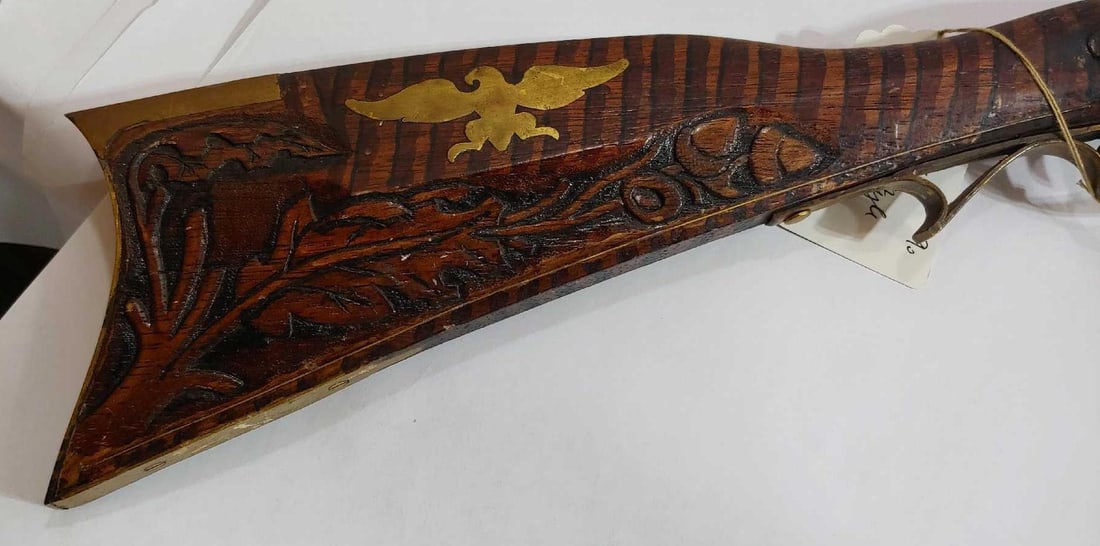STRIPED COLONIAL STYLE BLACK POWDER REENACTMENT LONG GUN: BRASS DETAIL WITH RAMROD. STOCK SHOWS BRASS FEDERAL EAGLE AND OAK LEAF DETAILING. 53 INCHES LONG
