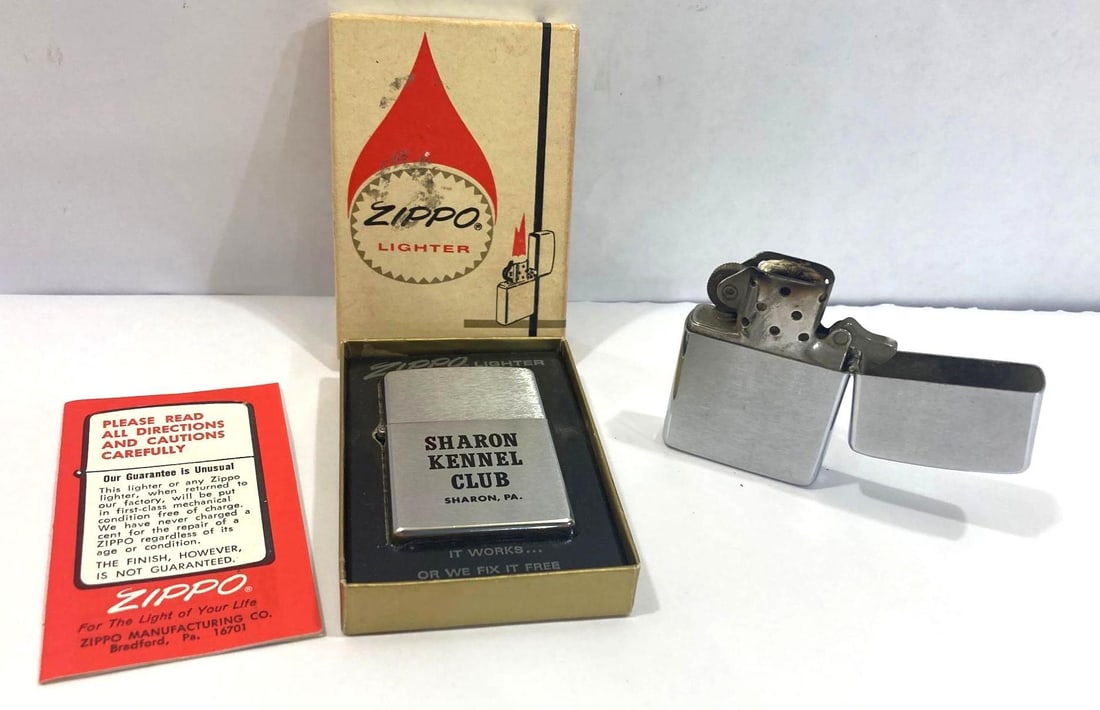 PAIR OF 1960s ZIPPO LIGHTERS: ONE DATED 1968, OTHER IS FROM THE SHARON KENNEL CLUB, SHARON, PA IN ORIGINAL BOX