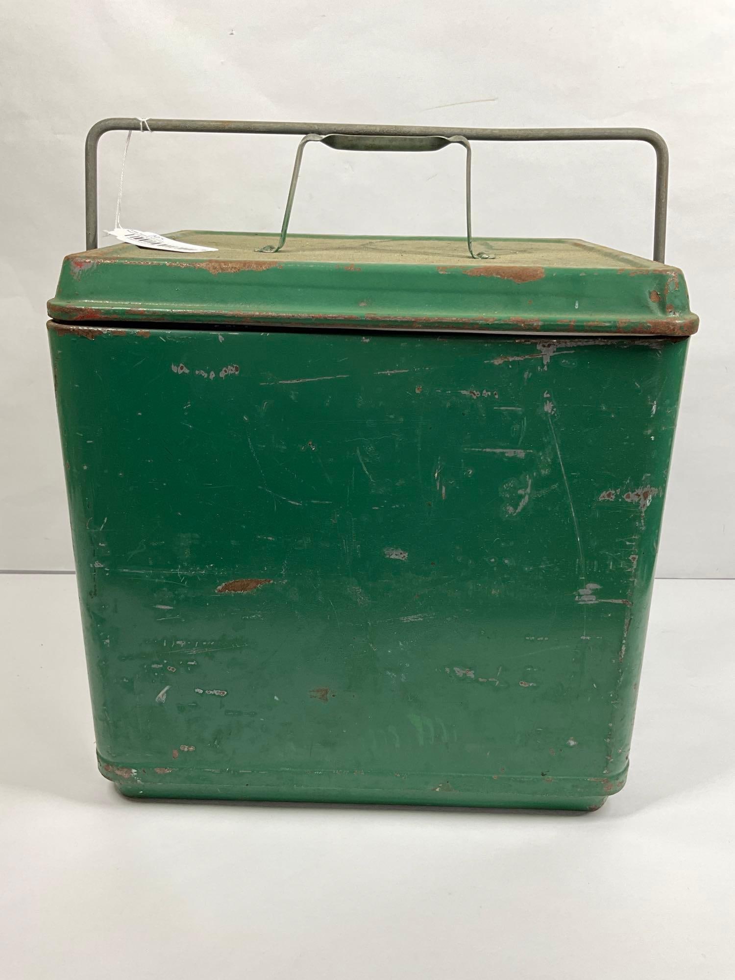 VINTAGE INSULATED METAL COOLER: GREEN PAINT SHOWS SEVERAL SCRATCHES AND MINOR DINGS. TIN LINED WITH BOTTLE OPENERS ON EITHER SIDE. 14.5X15X11