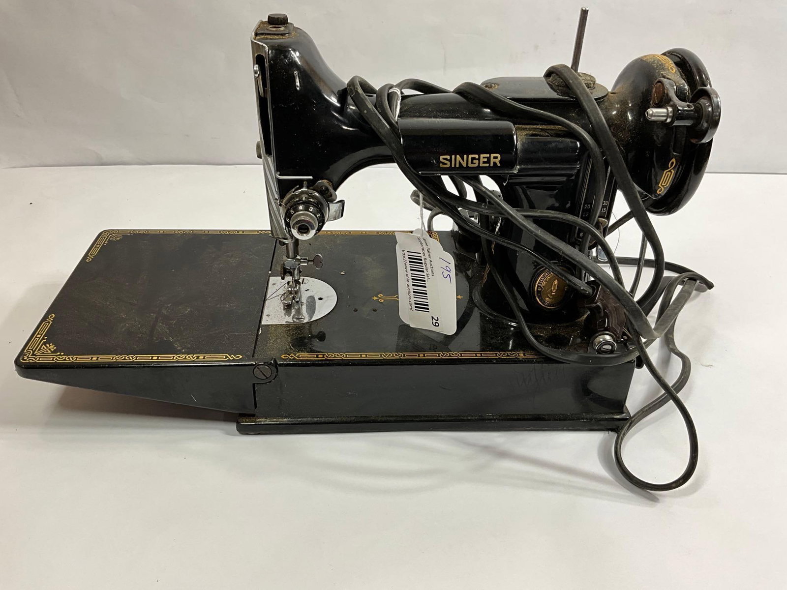 SINGER FEATHERWEIGHT: BELT IS TIGHT, AND NEEDLE MOVES BUT WITH SOME FORCE. THIS IS A CLEAN MACHINE AND COULD BE EASY CLEANED UP. CORD IS INCLUDED BUT NO CASE. MODEL NUMBER ON BOTTOM READS E6802957
