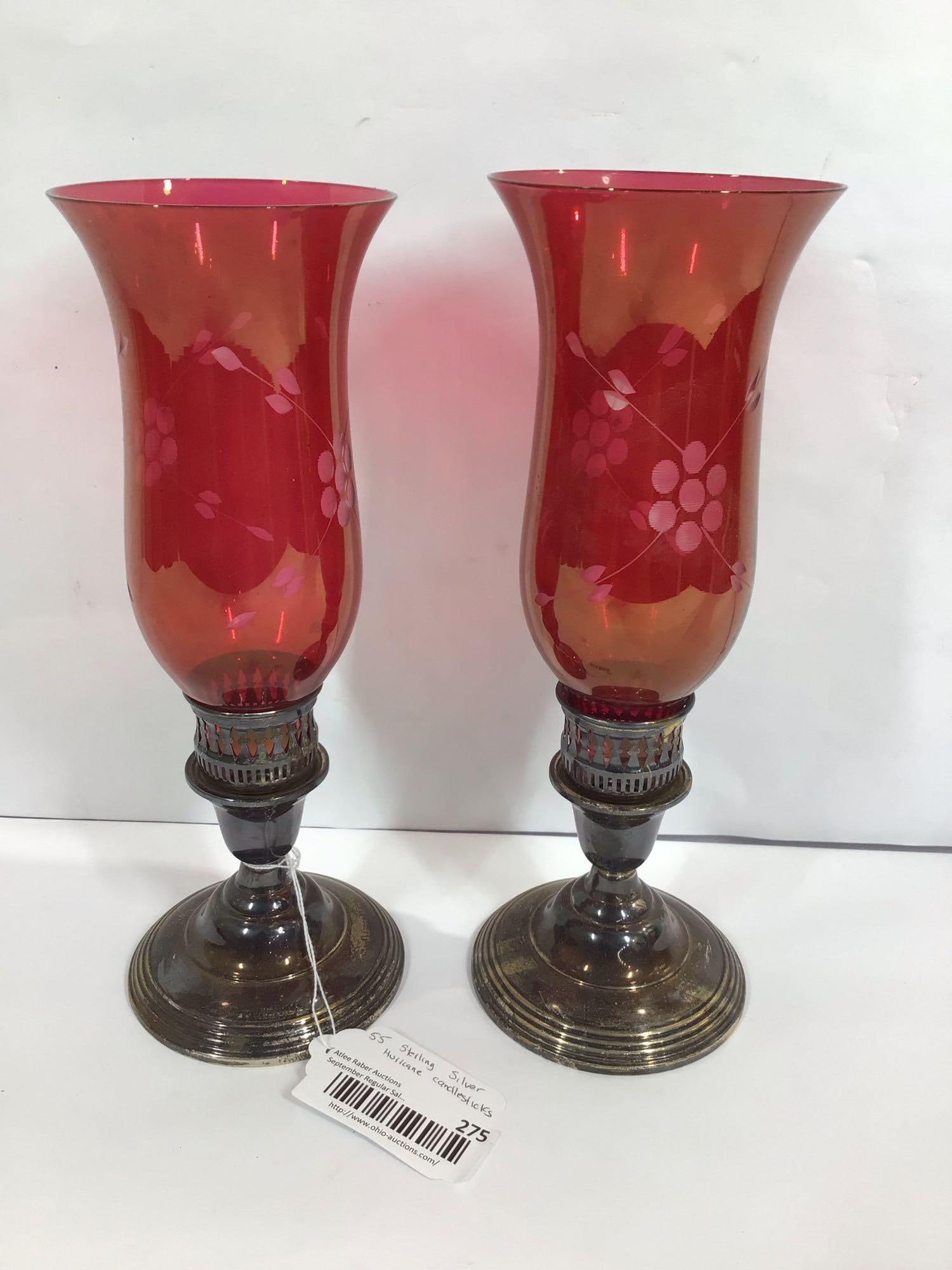 STERLING SILVER HURRICANE CANDLE STICKS: LOT OF 2 WITH CRANBERRY GLASS SHADES, CANDLESTICKS ARE MARKED STERLING. EACH IS 11.5 IN TALL