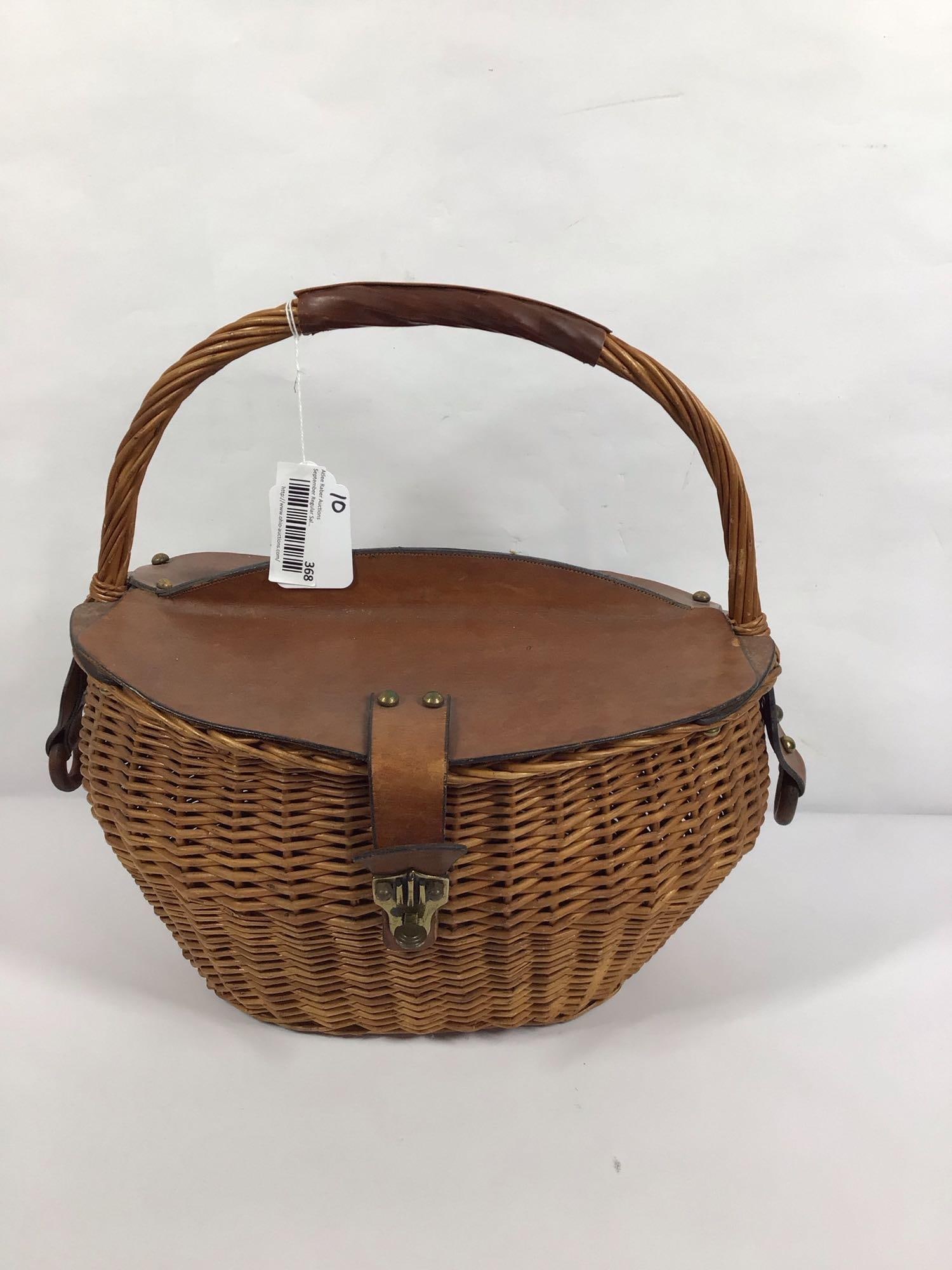 Woven basket with leather top: Oval shaped basket is 10in wide 15in long 16in tall to handle.