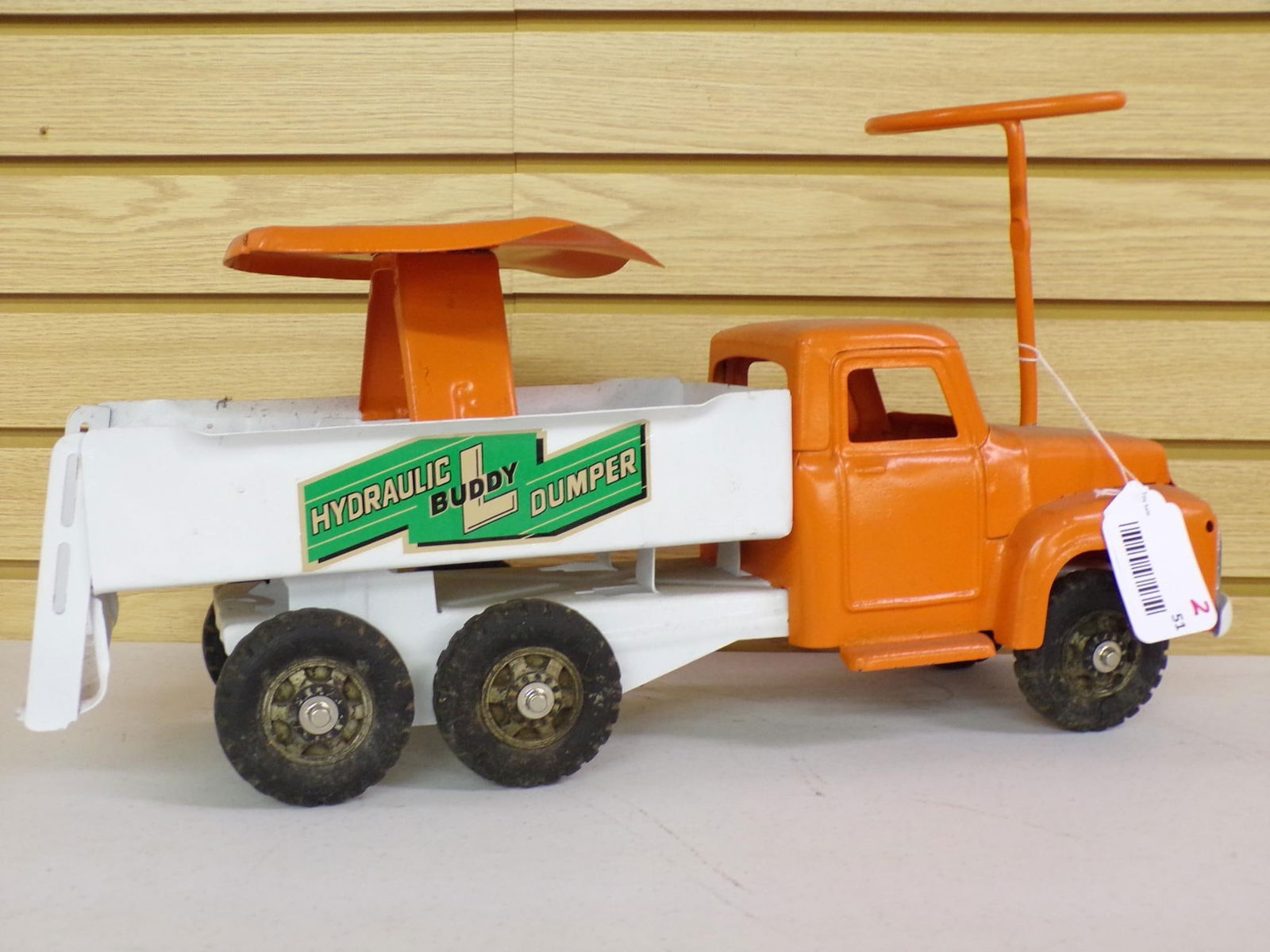 BUDDY L SIT AND RIDE DUMPER PRESSED STEEL RIDE ON: SHOWING MINOR CONDITION ISSUES AS SHOWN IN PHOTOS ORIGINAL LABEL COMPLETE ON ONE SIDE OF TRUCK