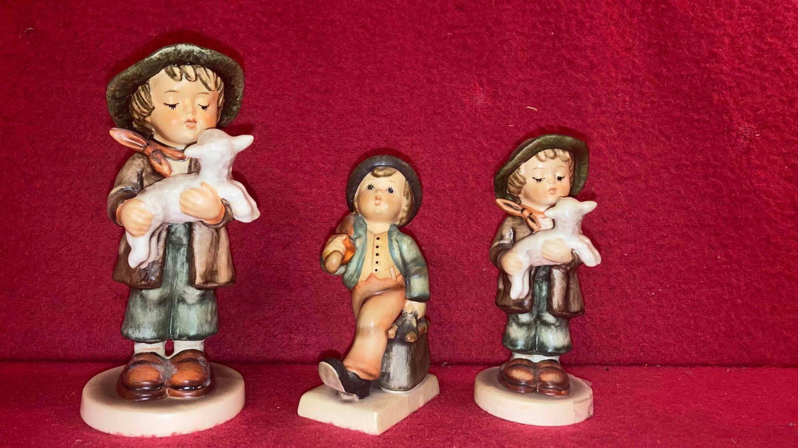 THE LOST SHEEP AND OTHER HUMMELS: TWO OF THE LOST SHEEP, ONE IS 4.5 IN AND OTHER IS 5.5 IN TALL. LOT OF THREE.