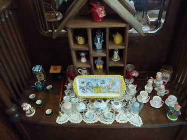 WOOD COMPARED DISPLAY SHELF ALONG WITH VARIOUS TEA SETS, KNICK KNACKS AND MORE