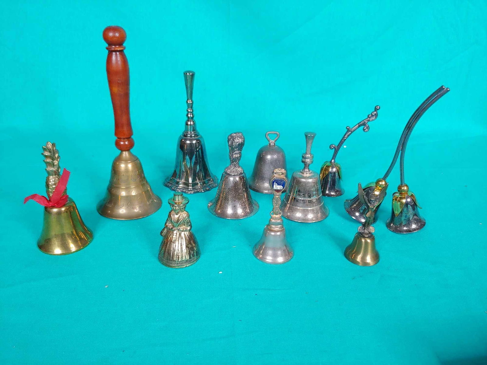 11 bells: Copper,silver coated, three are missing ringersand range from 3 to 7 inches