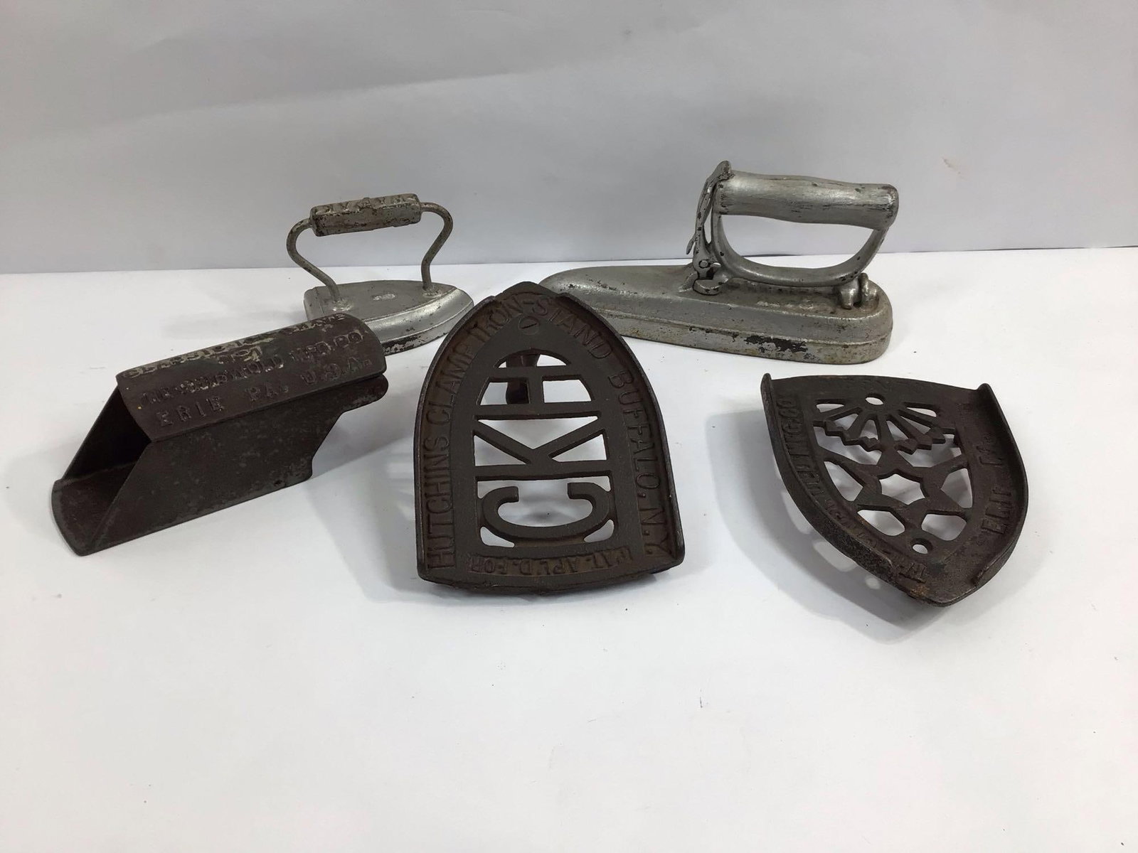 EARLY ICE SHAVER, TRIVET AND SAD IRON LOT INC. GRISWOLD, WAPAK AND HUTCHINS LOT OF 5 PCS.: THIS IS A GREAT COLLECTIBLE LOT THAT WOULD MAKE A GREAT ADDITION TO ANY CAST IRON COLLECTION