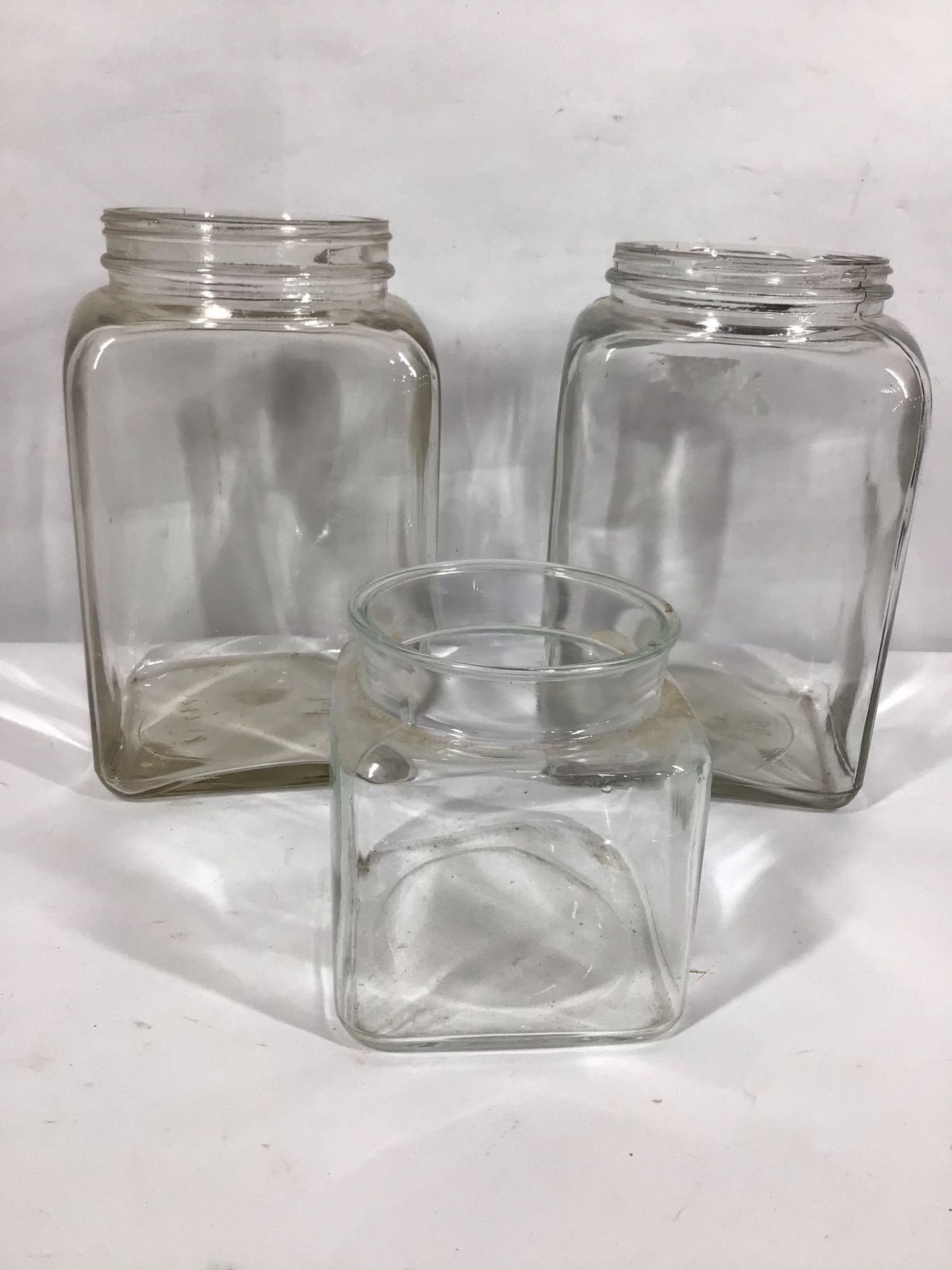 LOT OF 3 GLASS COUNTRY STORE JARS INC. TWO ATLAS AND ONE SMALLER: NO LIDS LARGE ARE 10" H AND SMALL 5.5" H