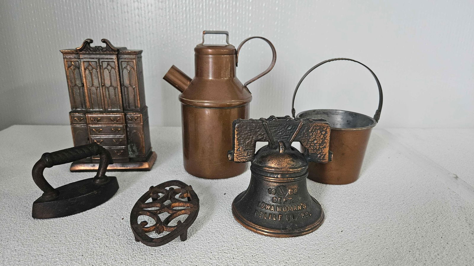 CAST IRON AND COPPER LOT INC. BANKS, TRIVET, SAD IRON AND MORE: THIS 6 PCE LOT WOULD MAKE A GREAT DISPLAY ADDITION TO ANY COLLECTION PLEASE SEE PHOTOS FOR FULL LOT DESCRIPTION