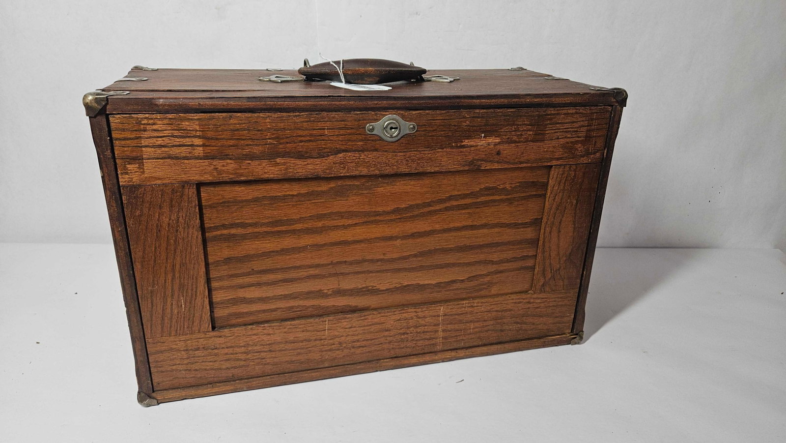 Early oak machinist chest: Shows some condition to veneer top, otherwise in good used condition. 20in long 9in deep 12in tall.