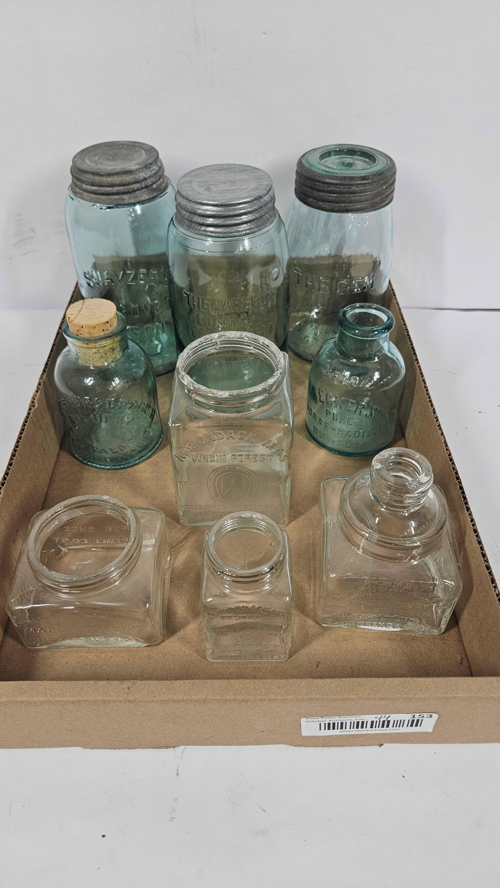 UNUSUAL GLASS APOTHECARY AND BLUE JARS: INCLUDES HORSE SHOE FORESTRY CO, HORSERADISH, BECKERS, SWAYZEES, THE GEM, AND THE HASEROT COMPANY. LOT OF 9.