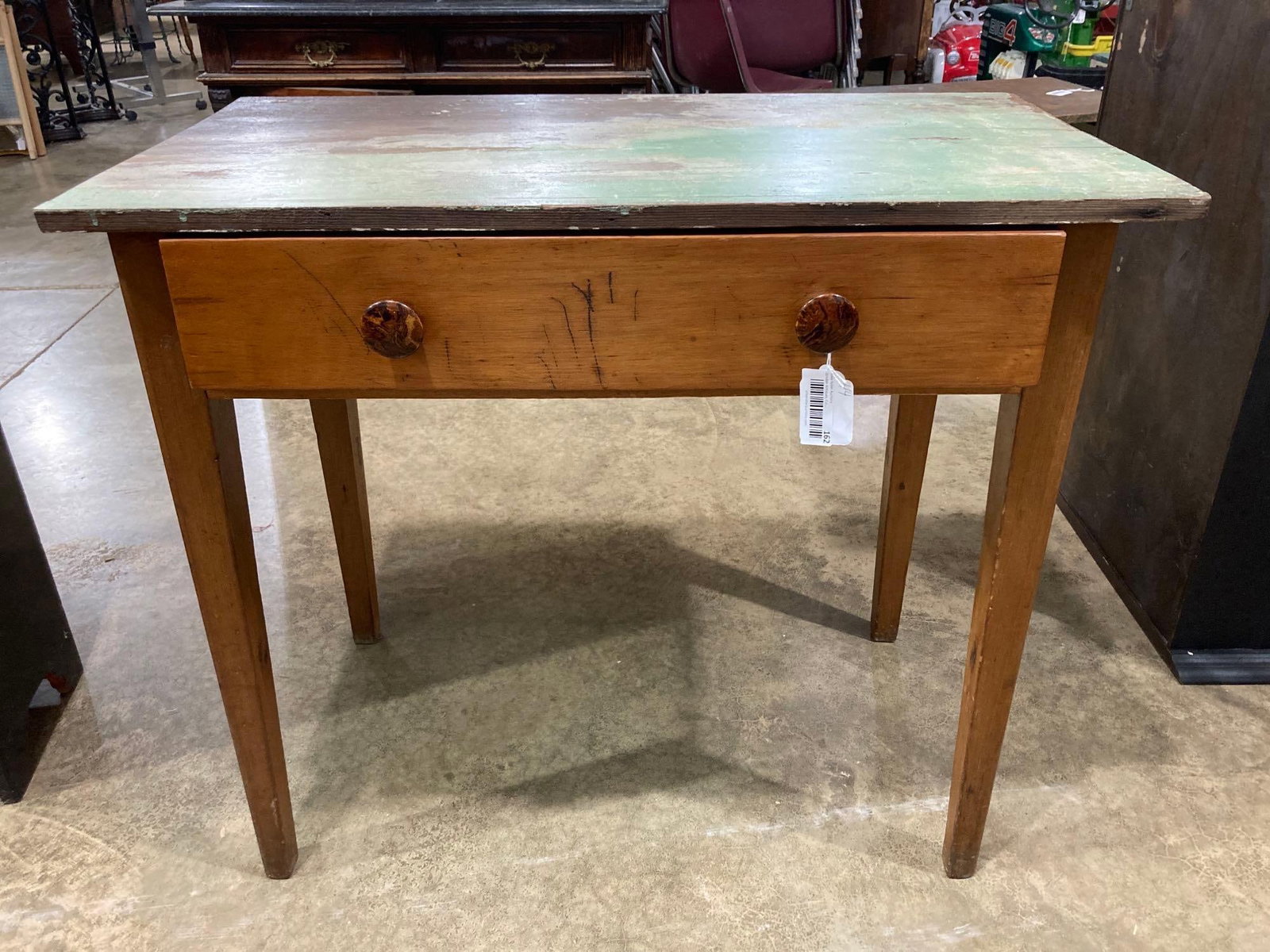 TAPERED LEG FARMHOUSE TABLE: GREAT GREEN TOP WITH A NATURAL BOTTOM AND BURL KNOBS. ONE DRAWER. 35X19X30.5