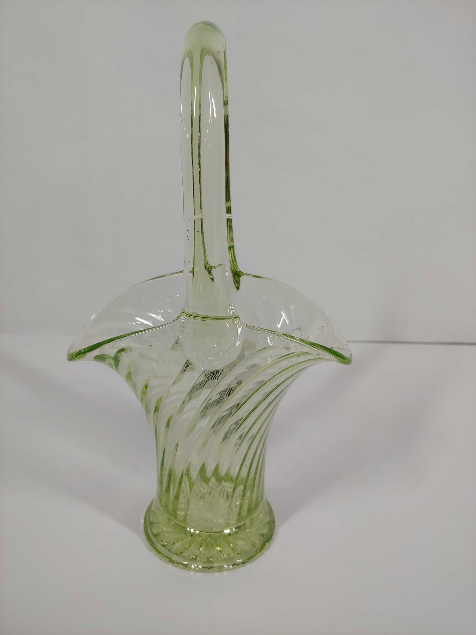 URANIUM GLASS BASKET: GLOWS GREEN UNDER UV LIGHT. 10 INCHES TALL