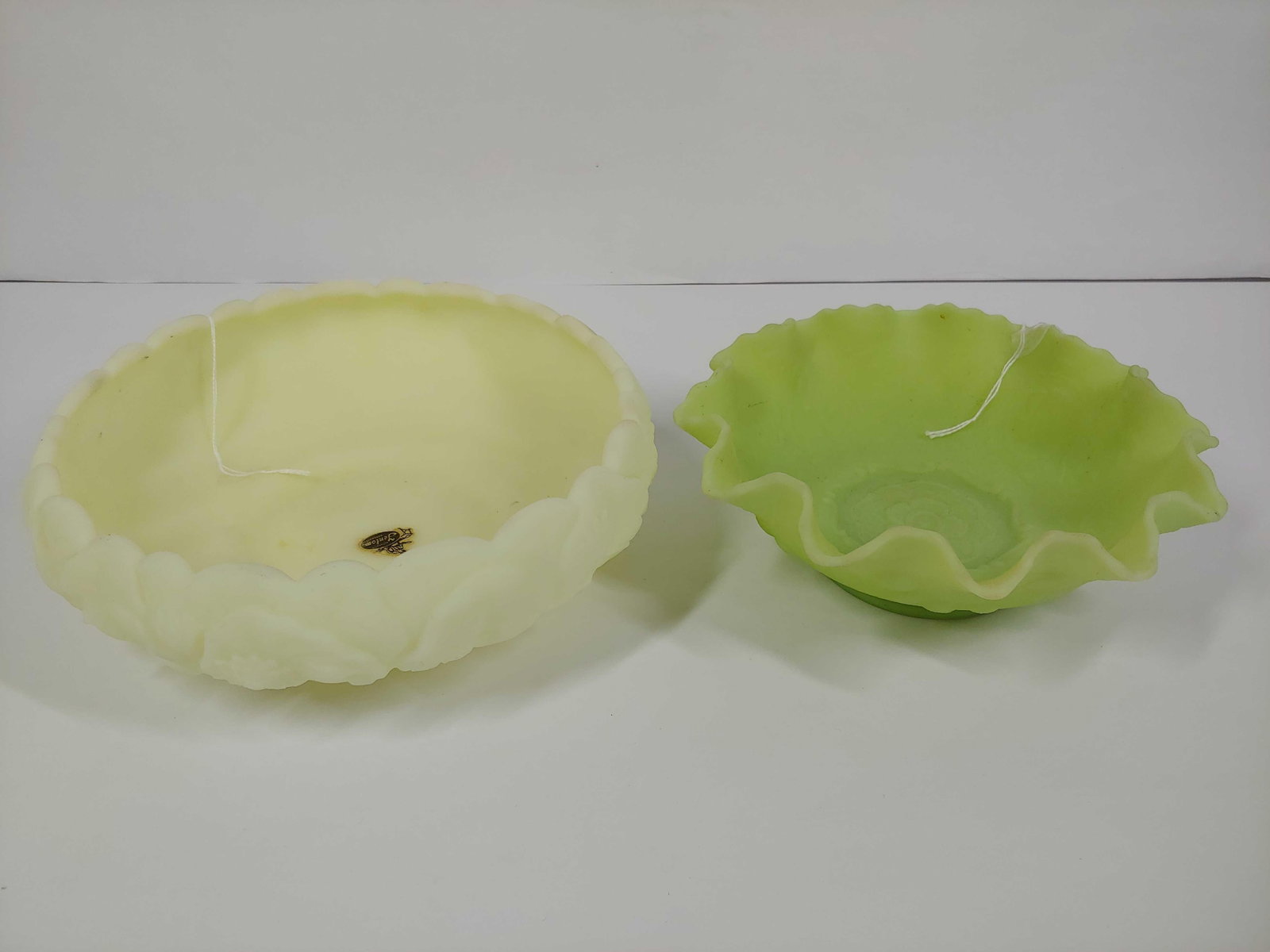 FENTON CUSTARD GLASS URANIUM GLASS BOWLS: BOTH GLOW GREEN UNDER UV LIGHT. 8 AND 7 INCH DIAMETERS. BOTH IN GOOD CONDITION, NO MAJOR CHIPS OR CRACKS