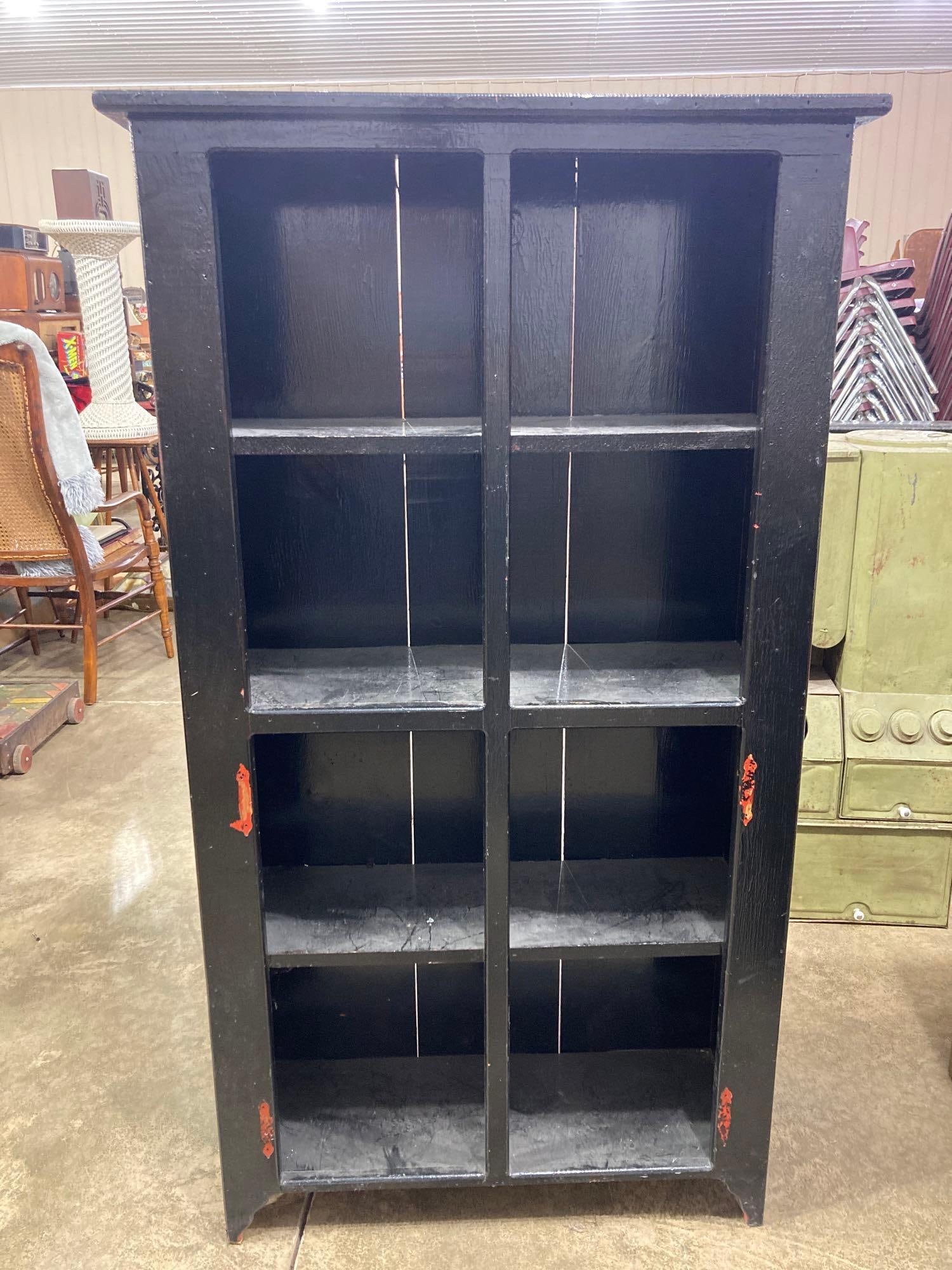 PRIMITIVE PINE 4 SHELF CABINET: DISTRESSED WITH A RED PAINT SHOWING THROUGH BLACK IN SEVERAL AREAS. 54X 30 X 11