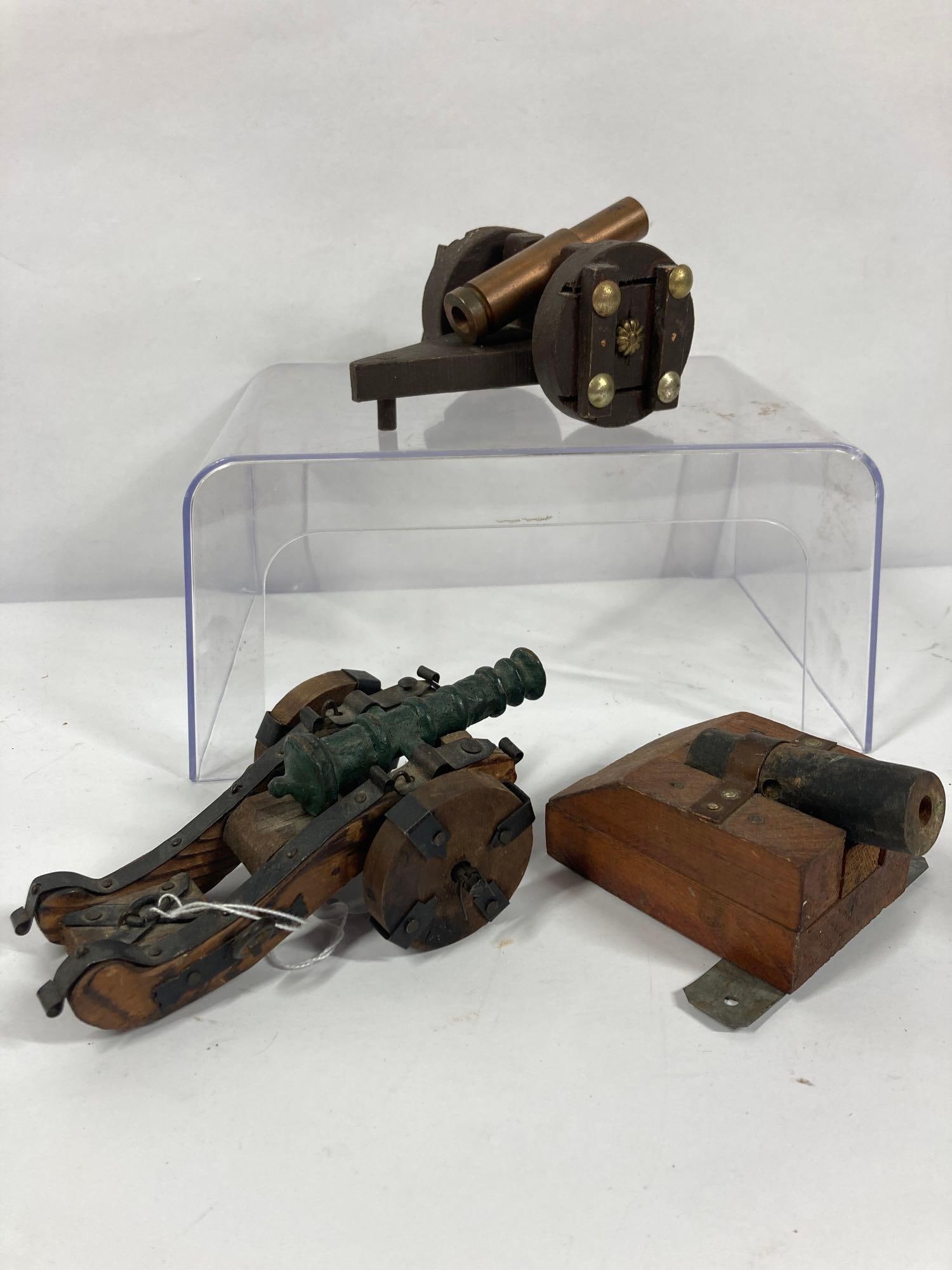 3- Small Folk art wood & metal cannons: Ranging from 4in to 6in long.