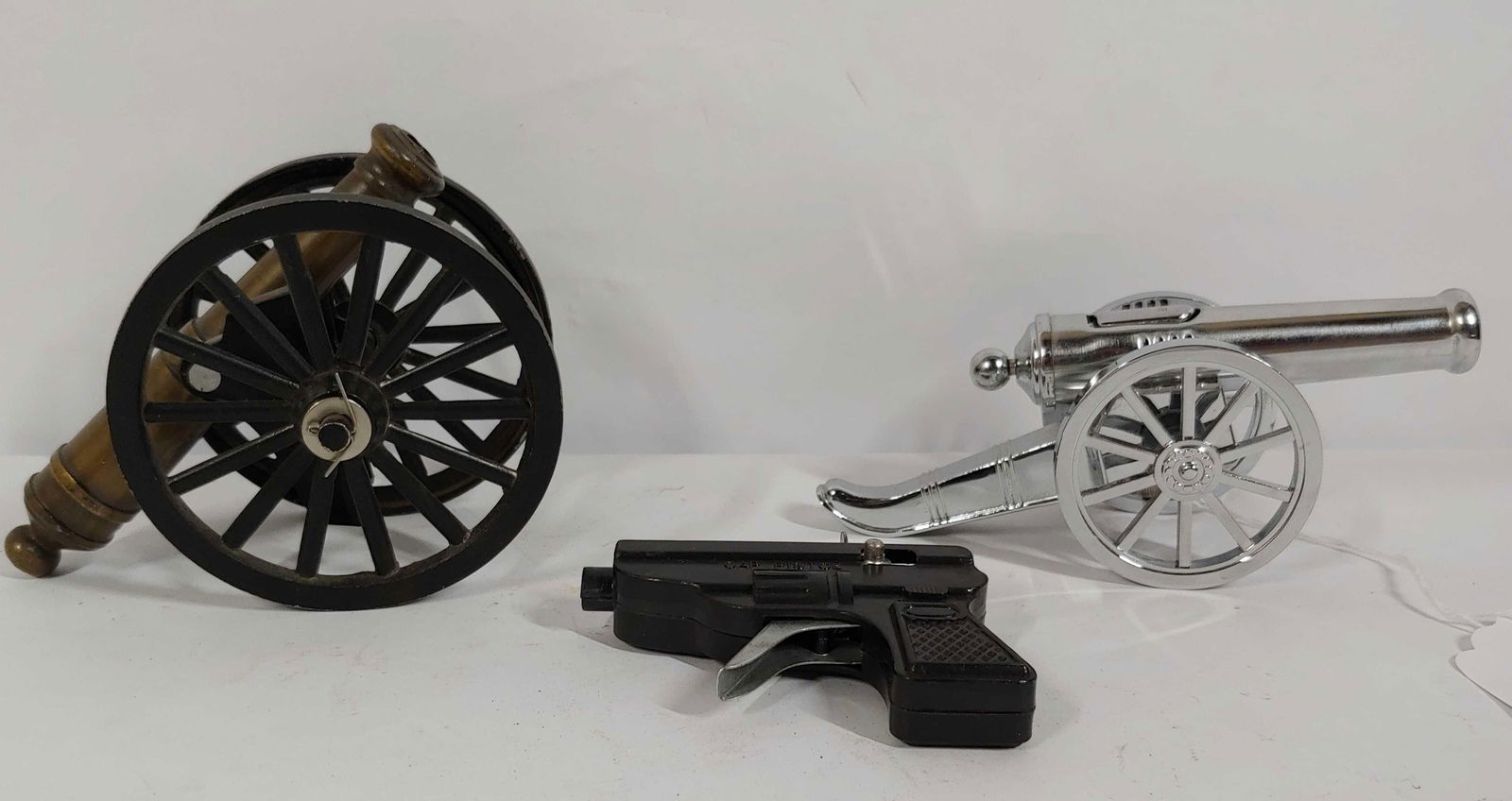 Small cast cannon, cannon lighter & cap pistol: Cannon shows a break on lower section. Please see photos
