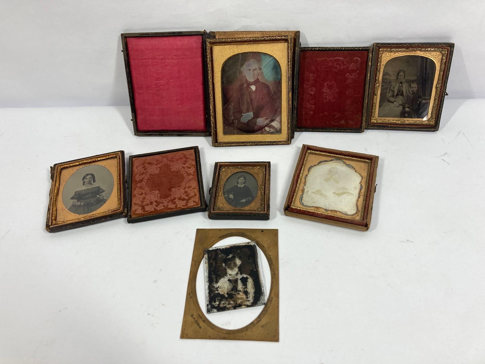 Daguerreotype Ambrotype Studio Photographs: lot of 6. Albums included but some show broken hinges.
