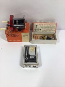 Johnny Walker Reel, Fish Scale, and Heddon Lure