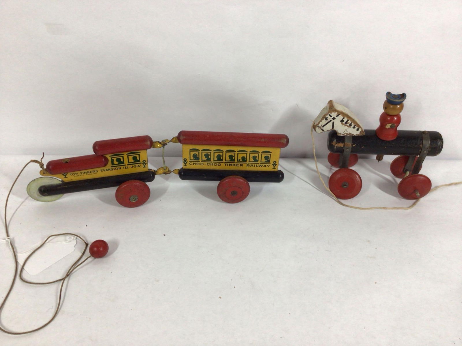 2-Early Evanston, Ill. Toy Tinkers pull toys: .