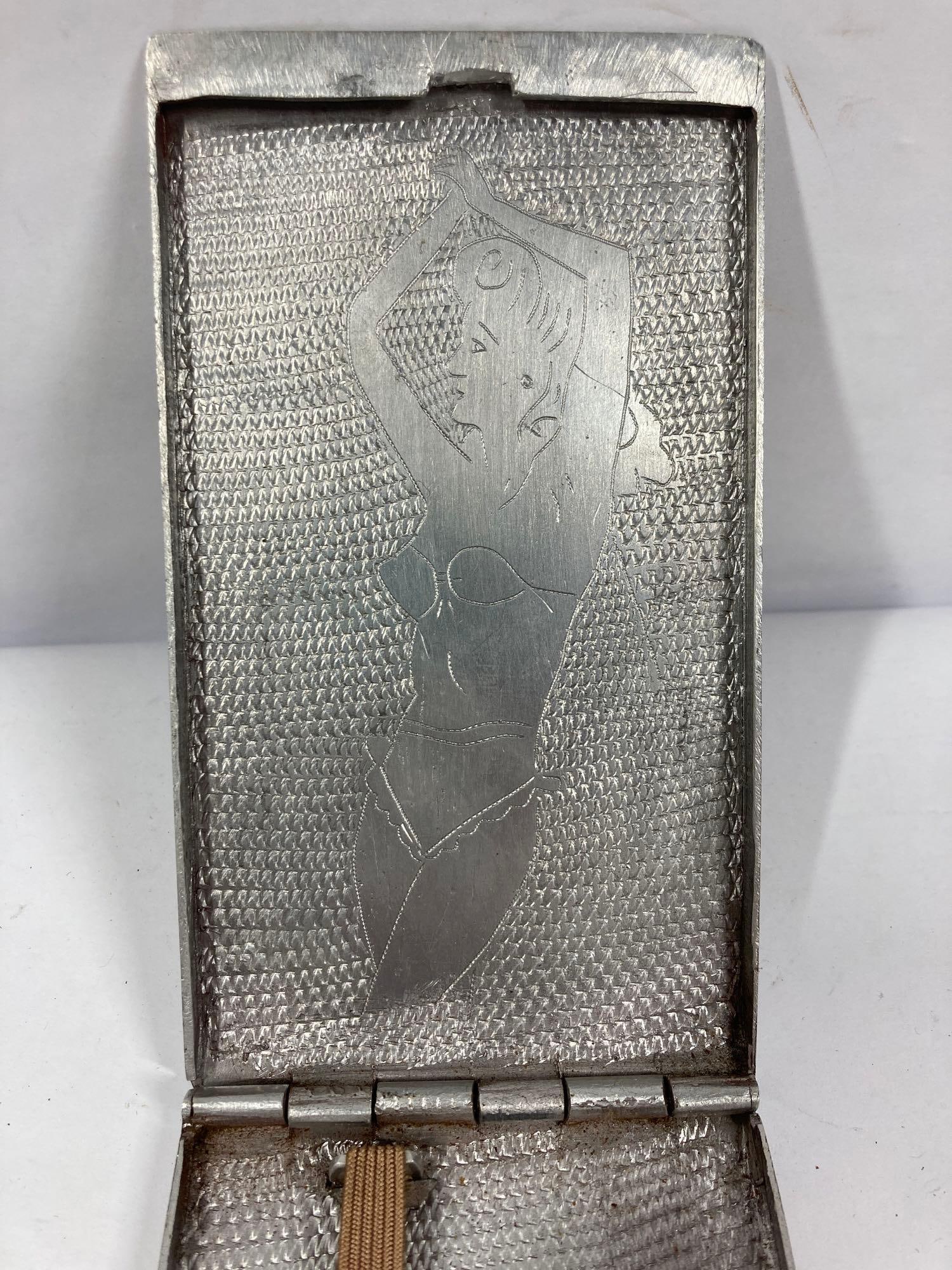 WW2 Comic Pin up girl Cigarette Case: Etching on interior and exterior.