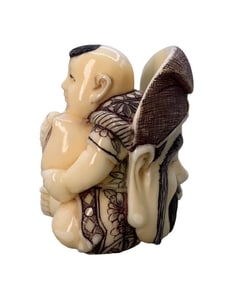 Hand Carved Japanese Boy with Immortals Mask Netsuke