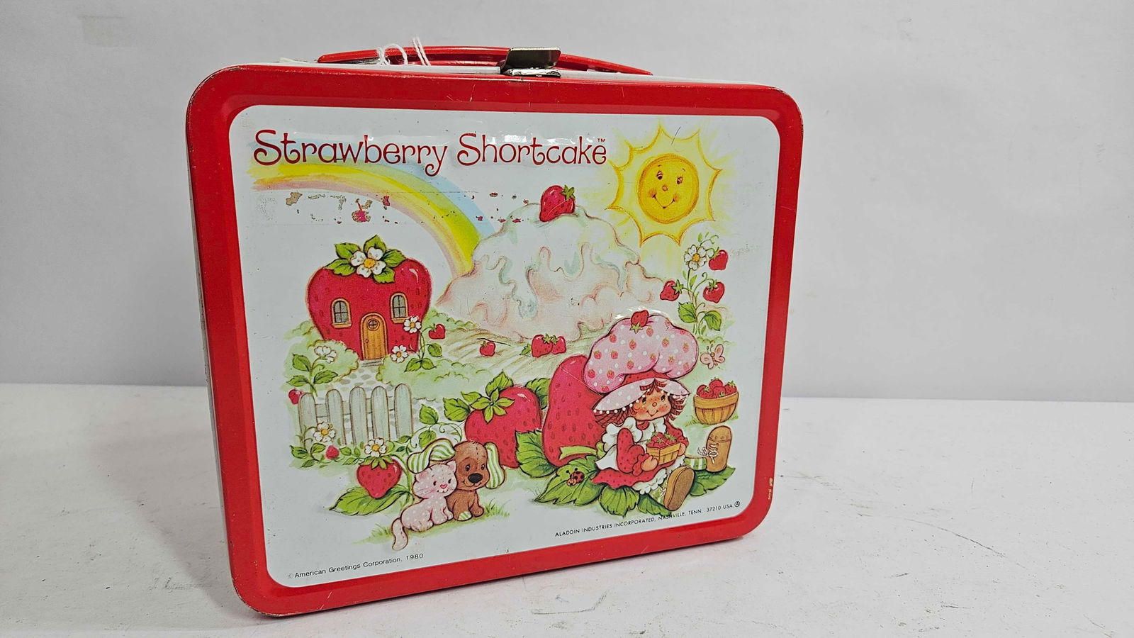 STRAWBERRY SHORTCAKE TIN LUNCH BOX AND THERMOS: 1980, BY ALADDIN BRAND