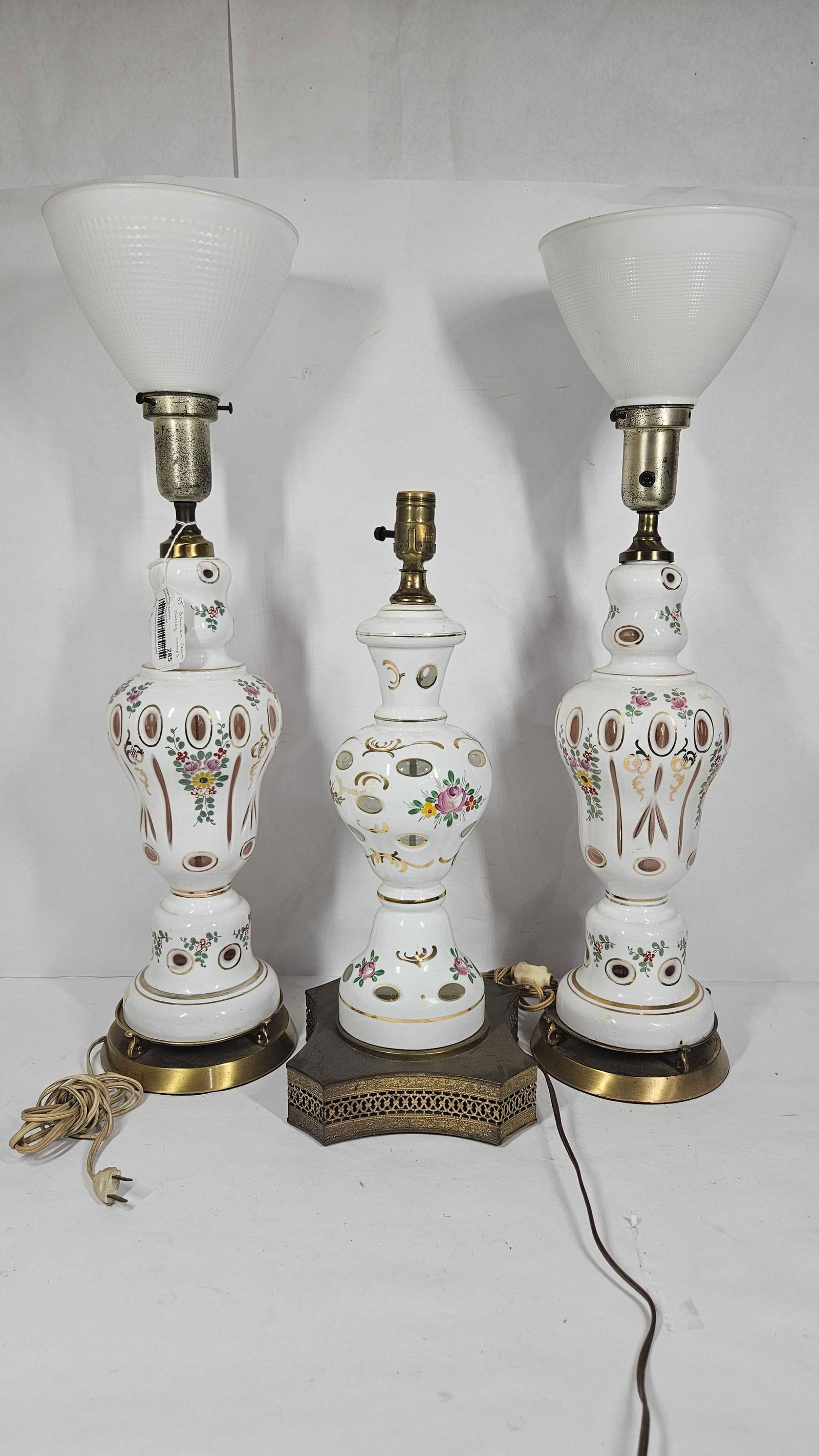 SET OF 3 BOHEMIAN GLASS LAMPS: TWO ARE MATCHING WITH MILK GLASS SHADES 23 IN TALL. ONE IS MISSING A SHADE AND IS 21 IN TALL