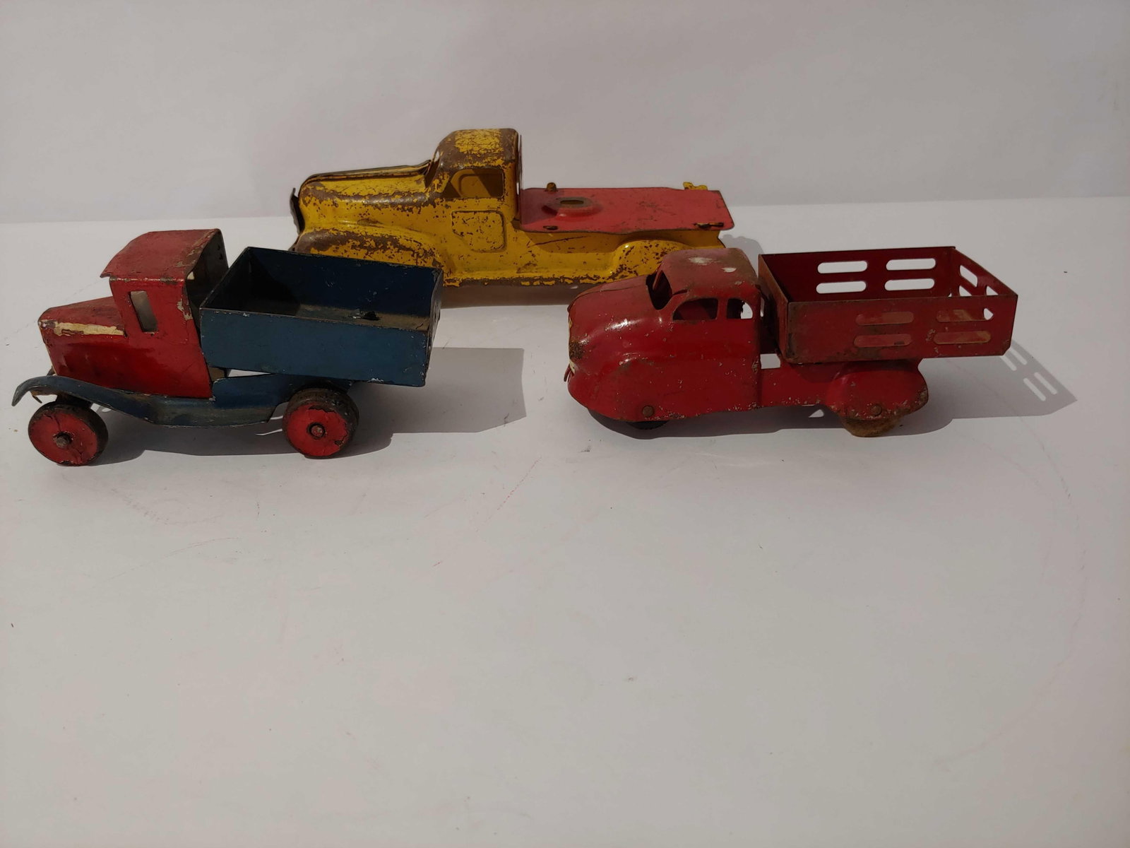 VINTAGE TOY TRUCK LOT INC. WYANDOTTE AND MARX: SHOWING CONDITION ISSUES DUE TO AGE AND PLAY