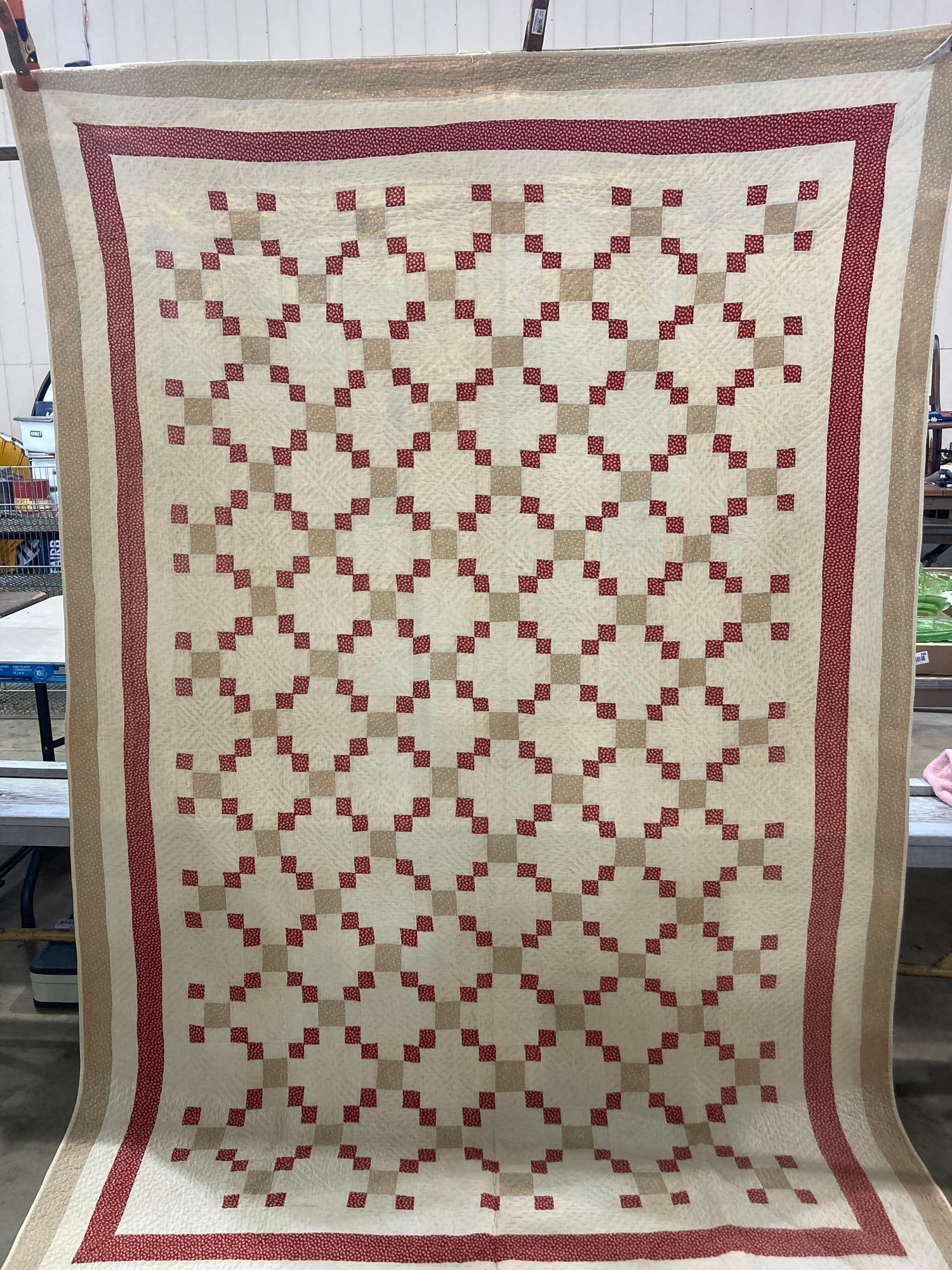 CREAM AND RED PATCHWORK QUILT: YELLOWING SHOWS DUE TO AGE. 62X92