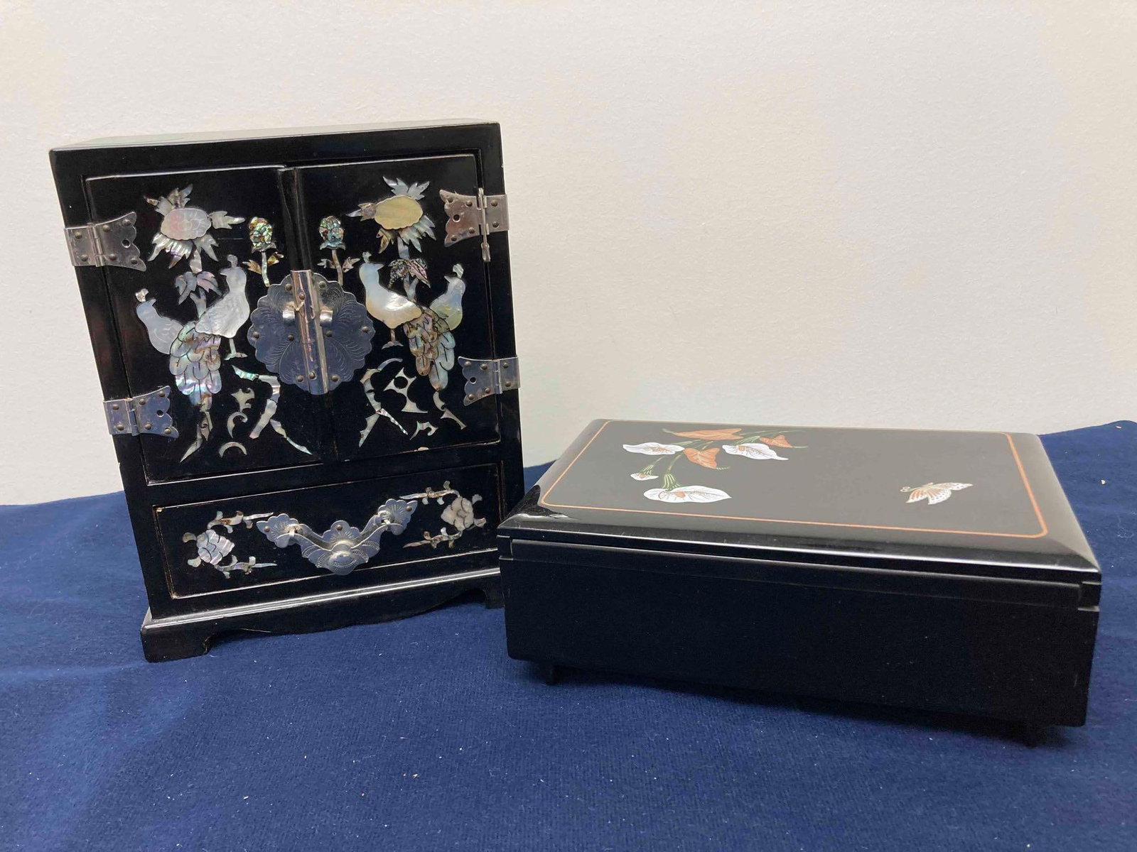 MOTHER OF PEARL INLAID JEWELRY CHESTS: BOTH ARE BLACK WITH DETAILED DESIGN. 8.5X6.5X3.5 CHEST AND TRINKET BOX IS 7.5 IN LONG