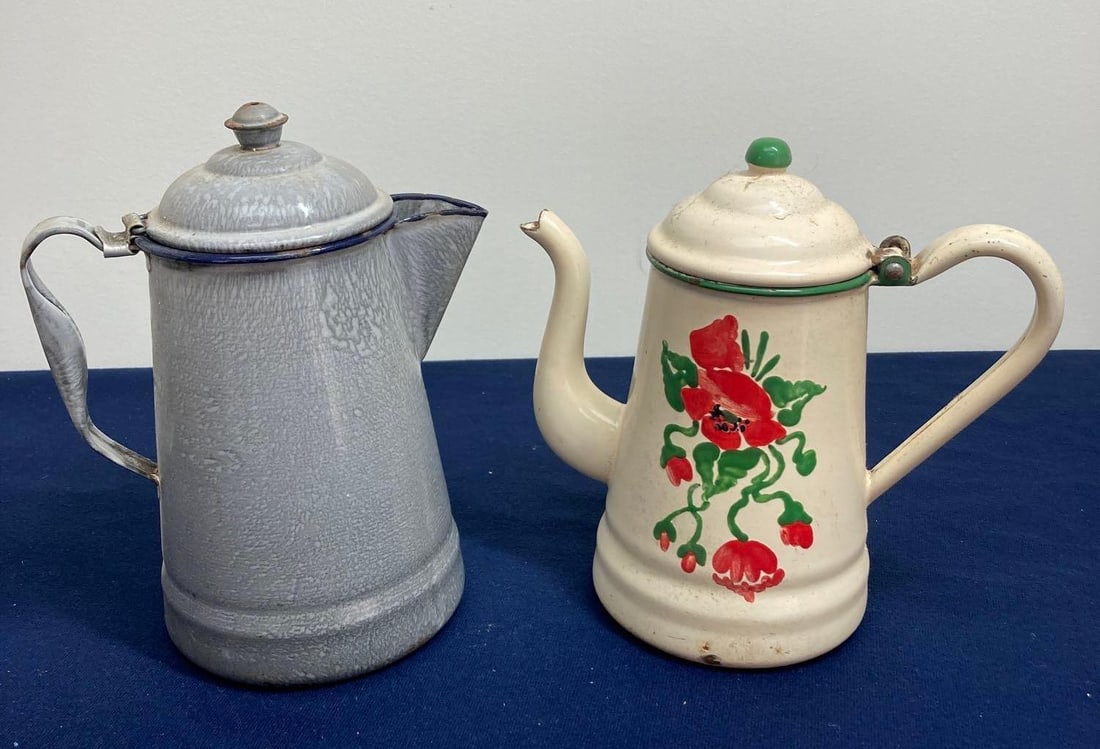 ENAMELWARE TEAPOTS: ONE FLORAL DECORATED, BOTH ARE CLEAN AND IN GOOD CONDITION