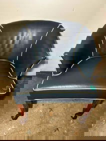 MID CENTURY LEATHER ARMCHAIR