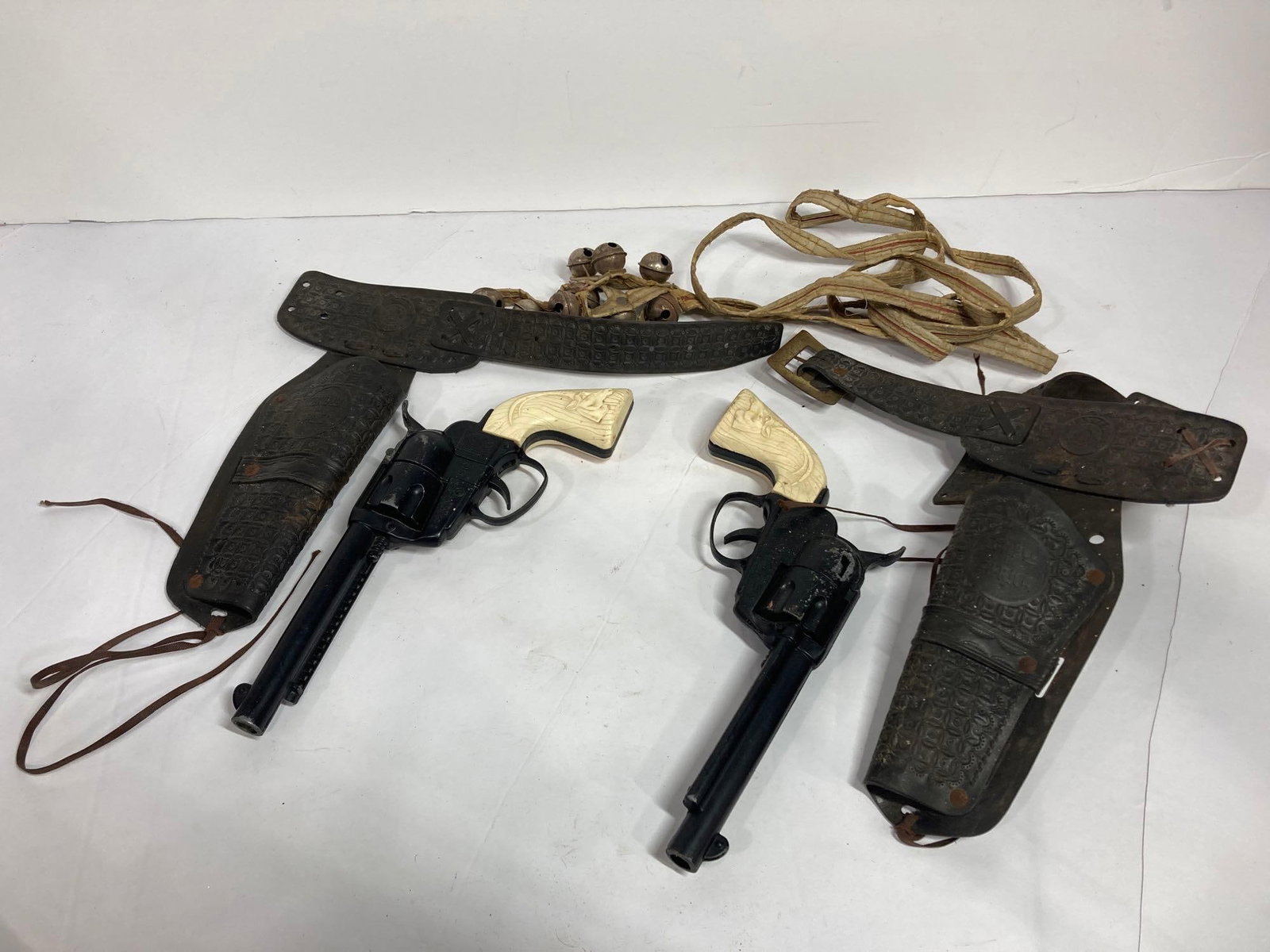 TOY COWBOY FANNER CAP GUNS: EACH WITH HOLSTER. BOTH BY MATTEL AND IN WORKING CONDITION.