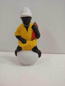 BOY ON POT CAST IRON COIN BANK