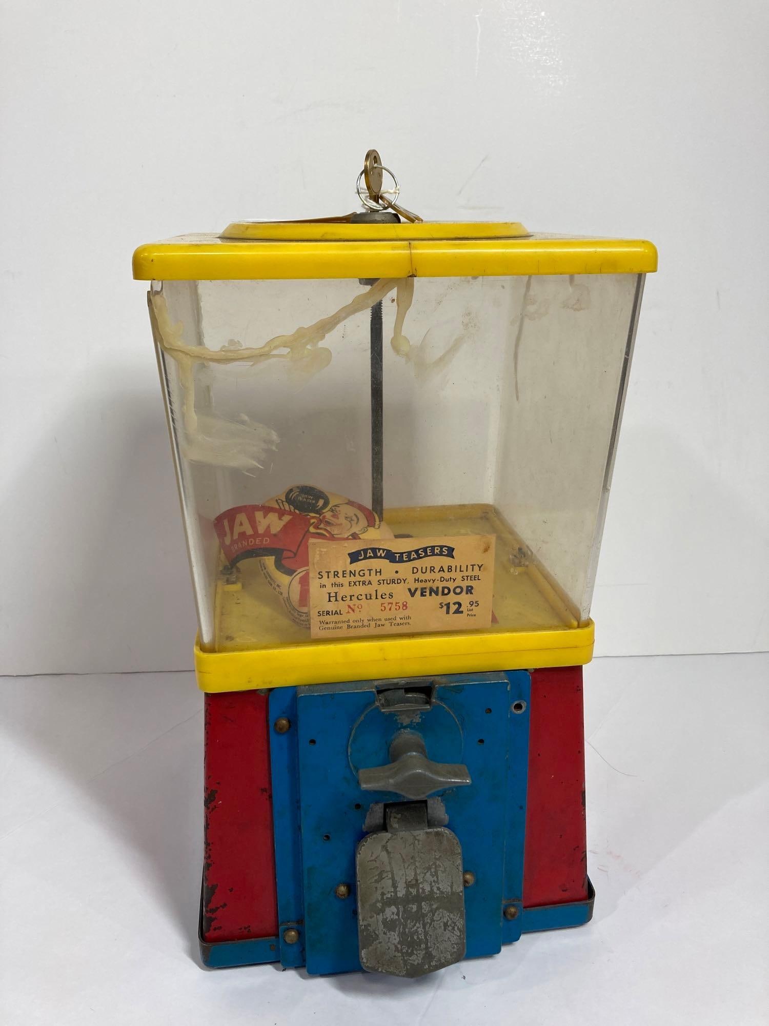 1 CENT BUBBLE GUM MACHINE: PLASTIC BODY AND DISPENSER. HAS BEEN REPAIRED. KEY IS INCLUDED. 14 IN TALL