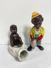 BOY WITH CHICKEN AND BOY ON POT CAST IRON BANKS