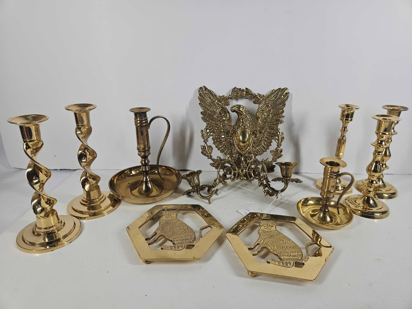 BRASS EAGLE AND OTHER CANDLE HOLDERS (1 of 6)