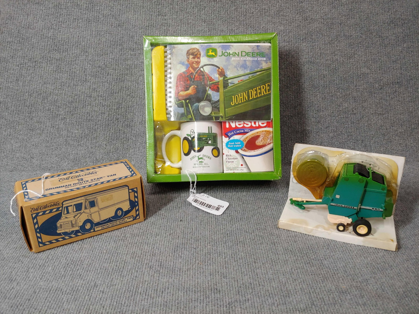 JD COLLECTIBLES, BAILER, AND BUEHLER'S DELIVERY VAN: JD MUG W CALENDAR, SMALL SCALE BALER AND ERTL GRUMMAN ROUTE STAR VAN